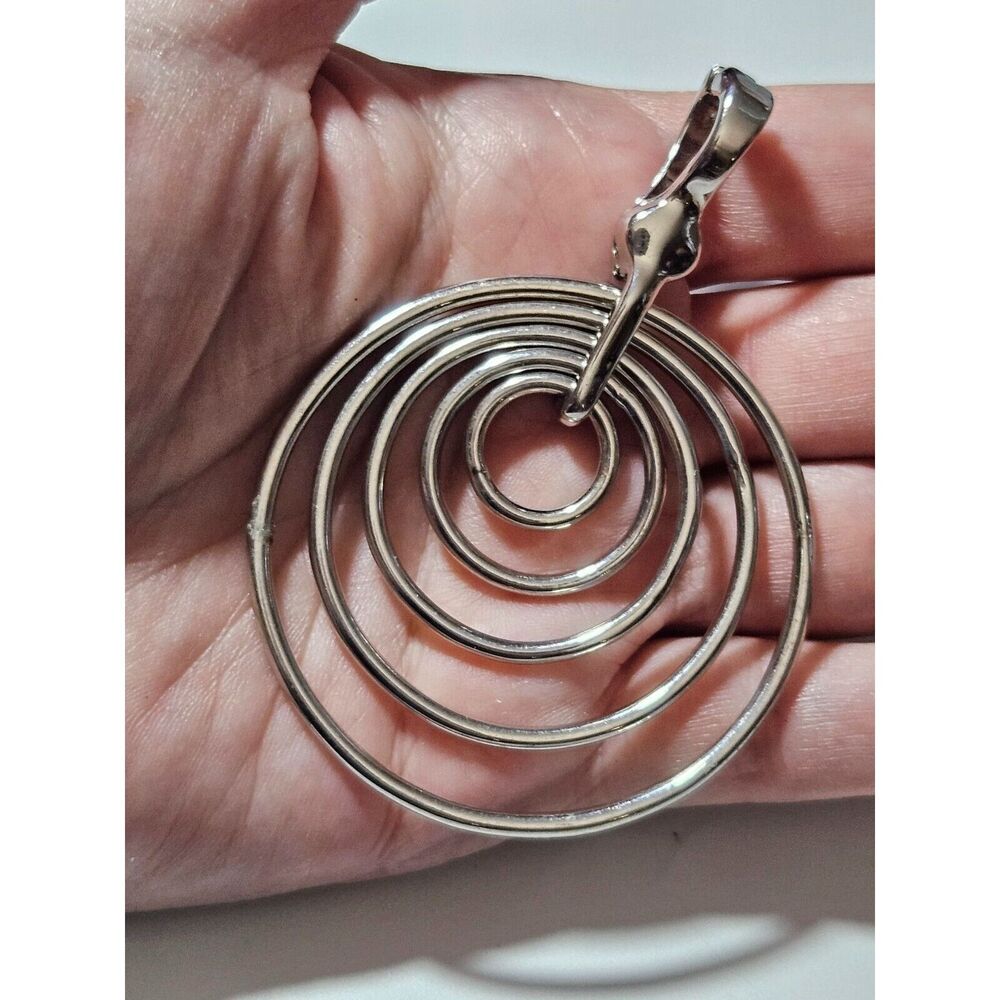 Roman silver tone pendant